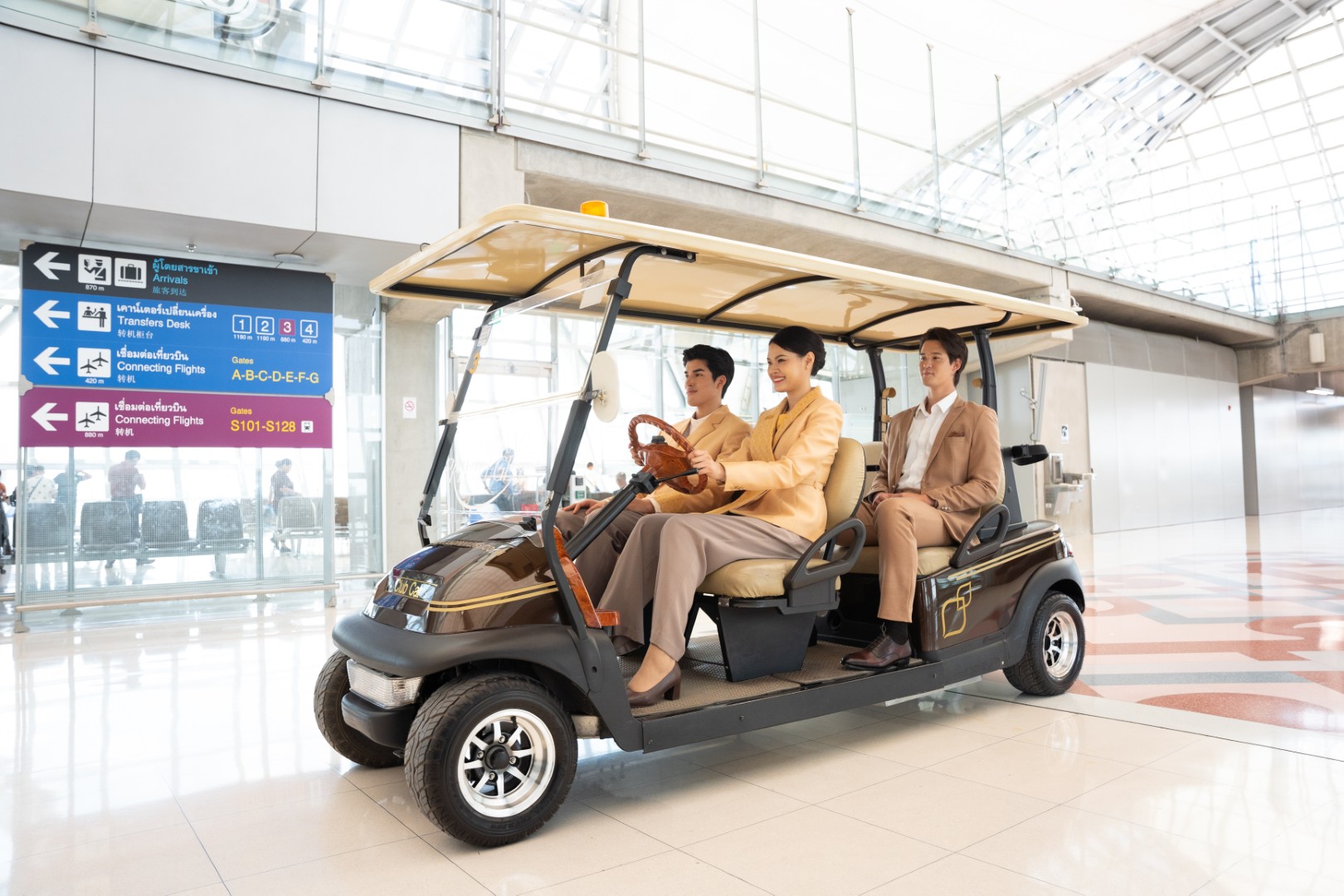 Thailand Privilege Elite Personal Assistants drive a member by electric cart through the Suvarnabhumi airport priority lane