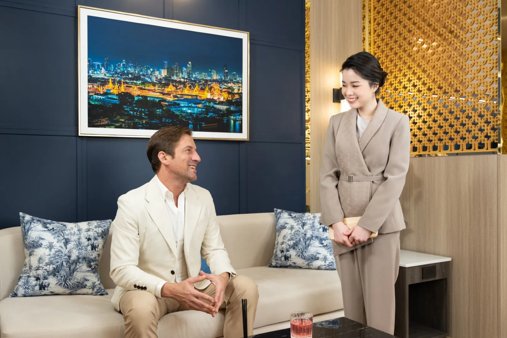 Thailand Privilege Elite Personal Liaison staff in conversation with a member inside the Suvarnabhumi VIP lounge