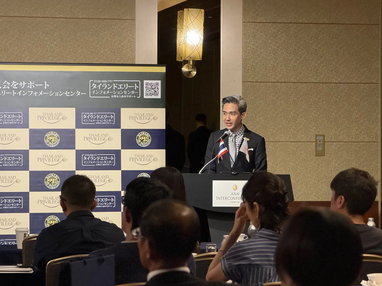 Kn. Manatase, President of Thailand Privilege Card Co., Ltd., delivering the opening address at the Japan Road Show 2026 Tokyo session, ANA InterContinental Tokyo, 30 May 2026
